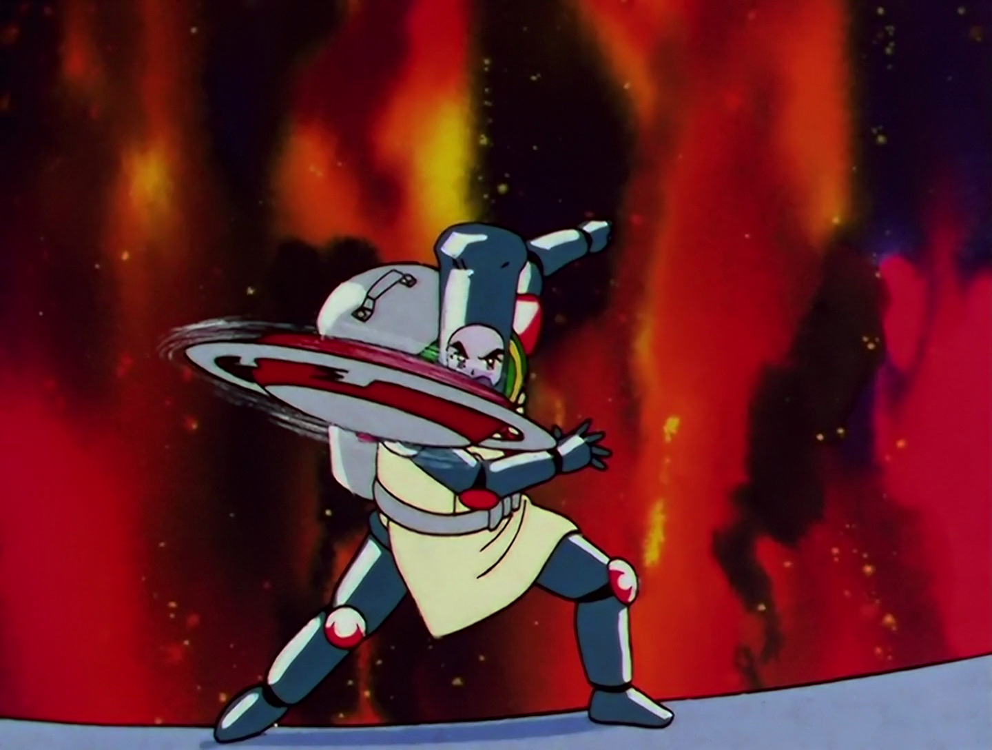 Here’s Sailor Chef from further away. He’s pretty bulky, and most of his body is shiny, dark gray and possibly metallic. The red coverings are also on his knee and elbow joints, and he’s wearing a white apron.